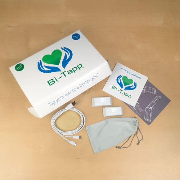 Bi-Tapp White Tapper kit with charging cable, storage bag and instruction booklets