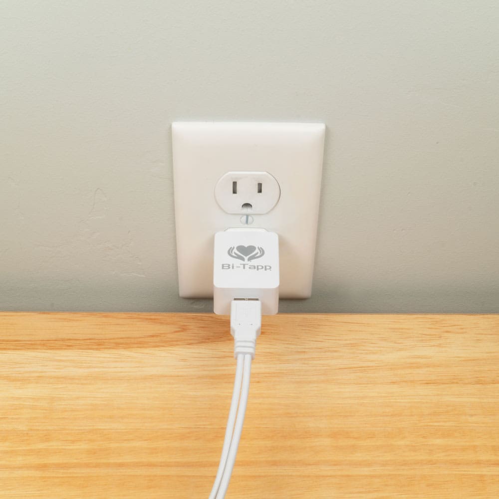 Bi-Tapp wall charger plugged into wall outlet