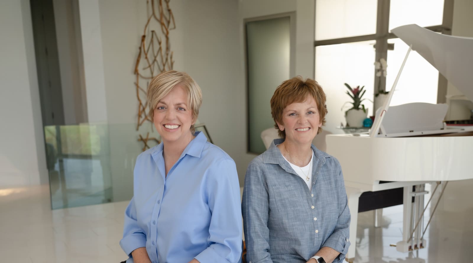 Cindy and Hayley, Bi-Tapp founders sitting side by side in a beautiful room